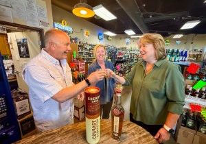 Michelle Bush (middle) and Jan Parker (right) toast with Gary Torsher, owner of Castle Pines North Wines & Spirits, before tasting Courage and Conviction Single Malt Whiskey on Saturday, April 12. After tasting it straight, they all added a piece of ice which Jan said “opened up” the wonderful flavor. 