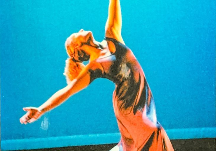 Becky Peterson performing a modern dance movement in a Denver theater in the early 2000s.