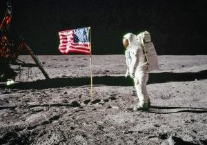 Astronaut Buzz Aldrin stands on the Moon facing a United States flag during the Apollo 11 mission in July 1969. Courtesy of NASA.