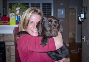 Stephanie Foster and her beloved chocolate Labrador retriever, Maple. Maple is the inspiration behind Stephanie’s involvement with the nonprofit One Cure, which supports the Flint Animal Cancer Center at Colorado State University. 
