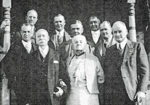 A family picture features George P. and Millie Stewart and seven sons, a product of their blended family. George P. and Millie are pictured at the left front. 