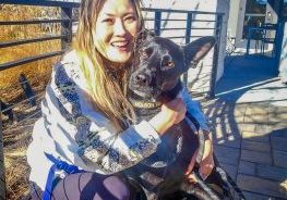 Ava Lee with Molson at The Exchange Coffee House near their home in The Canyons neighborhood.