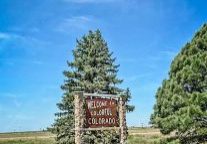 This welcoming sign stands alongside westbound I-70 in the eastern plains where the highway departs Kansas and enters Colorado.