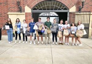 With eggs bagged and ready to go, these Valor Christian High School students were eager to hide candy filled eggs at donating homes as a fundraiser.