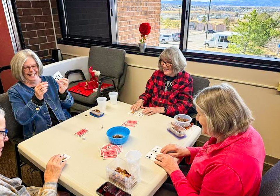 Members of the Castle Rock Senior Activity Center having a good time playing Polish Poker. The card game is played with pennies and is a favorite activity for many of the members.