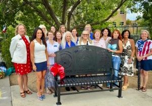 The Castle Rock Chapter of the National Society of the DAR surrounding the bench at Festival Park they commissioned to commemorate Colorado’s 150th and America’s 250th birthdays. State Senator Lisa Frizell, first left, and Congresswoman Lauren Boebert, second from left, attended with other elected officials.