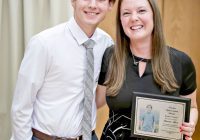 RCHS student Bentley Glauser honored Hannah Klein, RCHS Spanish teacher. He presented her with a plaque that included his photograph and the tribute he shared with the audience at the annual Teacher Appreciation.