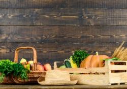 Autumn harvest crops vegetables. Locally grown natural food. Farmers market. Vibrant and colorful vegetables. Homegrown vegetables. Fresh organic vegetables wicker basket. Fall harvest concept.